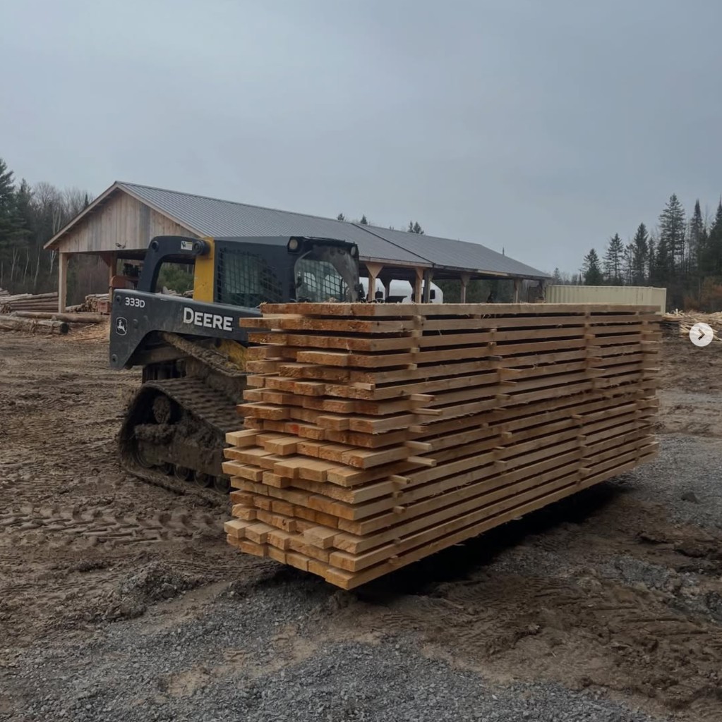 John Deere loader carrying pine lumber at Andrews Forestry & Construction, Douglas ON