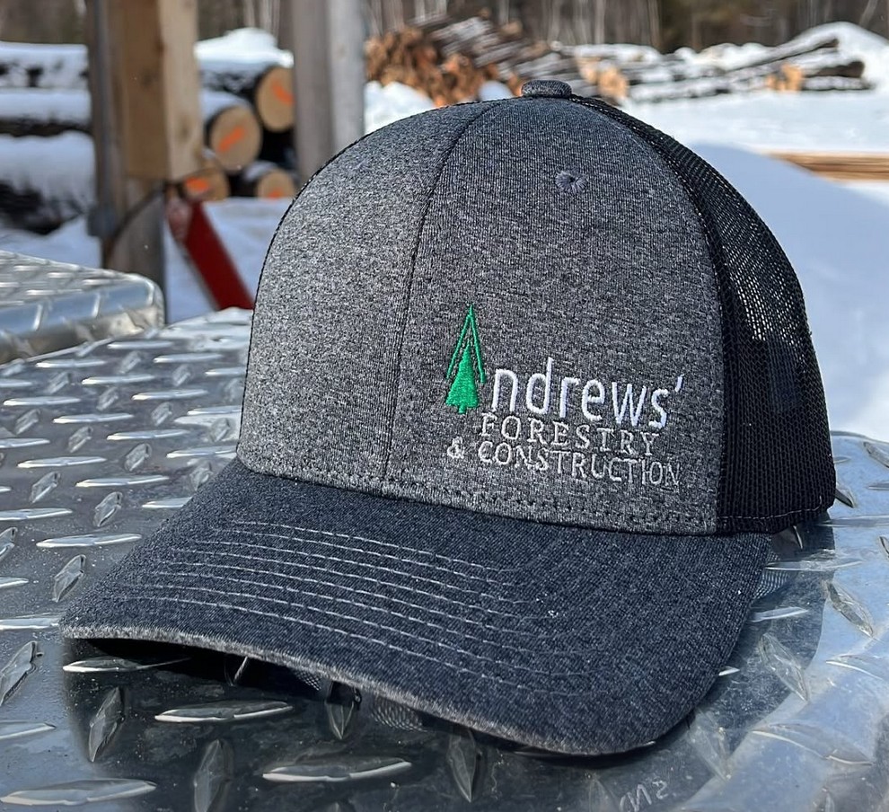 Andrews Forestry & Construction branded trucker hat with embroidered logo